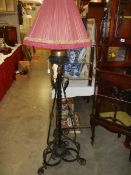 A 19th century wrought iron standard lamp with shade, COLLECT ONLY.