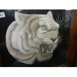 A framed and glazed embroidered tiger head. COLLECT ONLY.