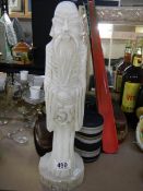 A tall alabaster figure of a Chinese gentleman.