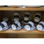 Eleven Royal Osborne black and white cups and saucers.