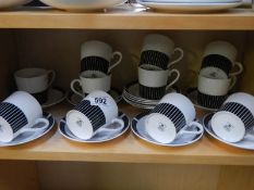 Eleven Royal Osborne black and white cups and saucers.