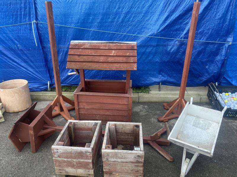 A collection of wooden garden items and planters
