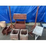 A collection of wooden garden items and planters