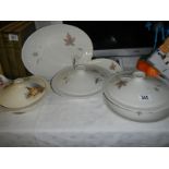 Two Royal Doulton Tumbling Leaves pattern tureens, platter etc., and a crinoline lady tureen.