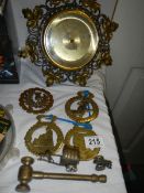 A mixed lot of brassware including horse brasses.
