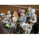 A mixed lot of figures, glass paperweights etc.,