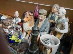 A mixed lot of figures, glass paperweights etc.,