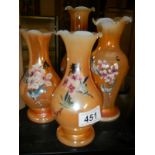 Four 20th century hand painted glass vases.