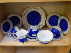A part blue and gold china tea set.