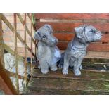 Two garden dog statues