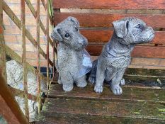 Two garden dog statues