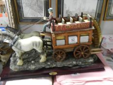 A 20th century ceramic horse drawn bus pulled by two horses, COLLECT ONLY.