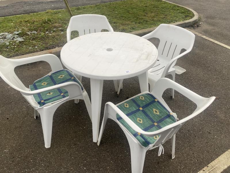 A plastic garden set including table and 4 chairs
