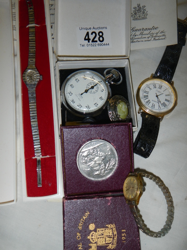 A Smith's stop watch, Festival of Britain coin and other watches.