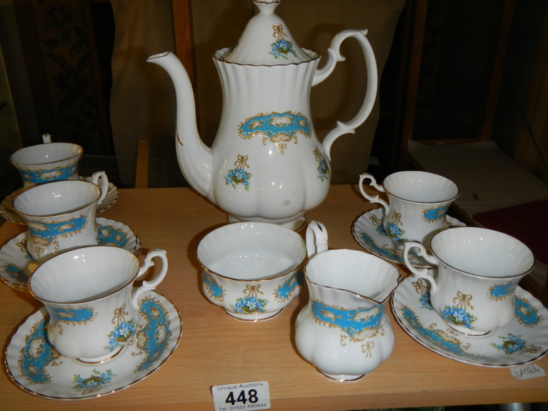 A part English bone china coffee set (missing one cup & saucer).