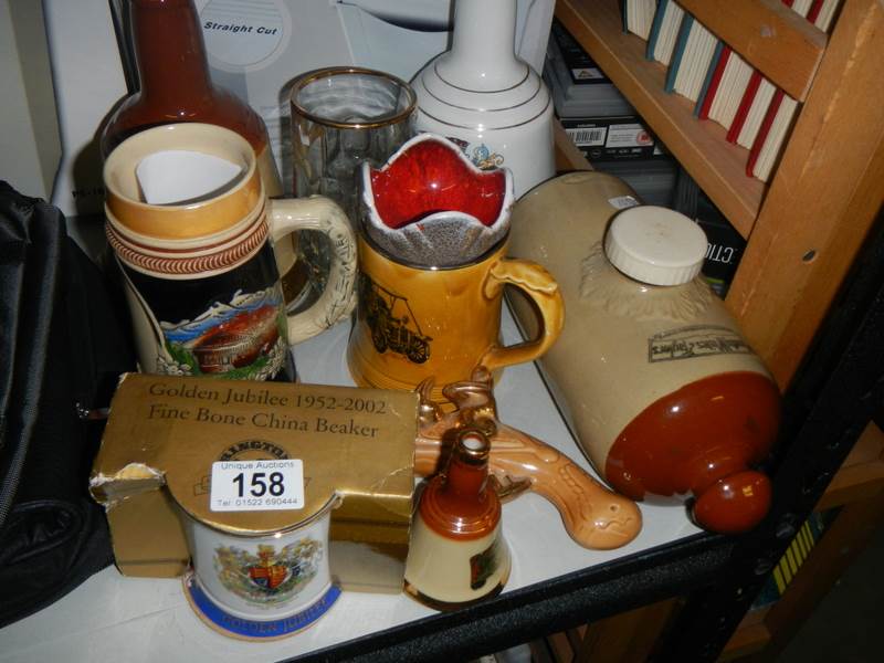 A mixed lot including Wade Bells, stoneware hot water bottle etc.,