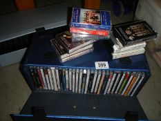 A quantity of CD's and cassette tapes.