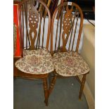 A pair of wheel back kitchen chairs, COLLECT ONLY.