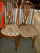 A pair of wheel back kitchen chairs, COLLECT ONLY.