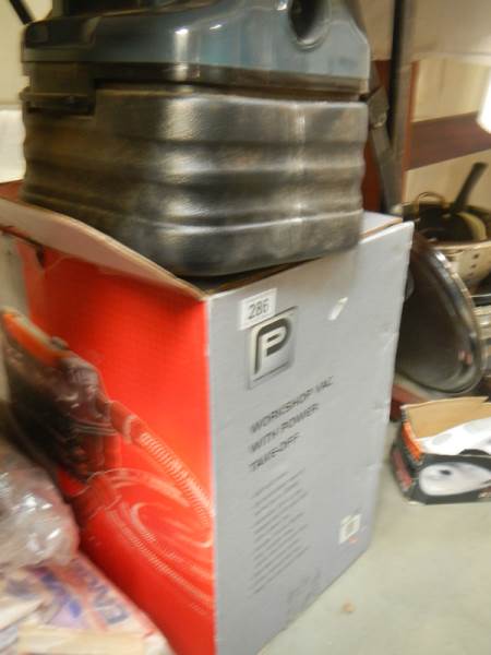 A boxed workshop vacuum cleaner.