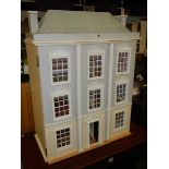 A three storey dolls house in good condition. COLLECT ONLY.