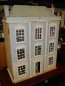 A three storey dolls house in good condition. COLLECT ONLY.