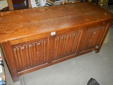 An oak linen fold blanket box. COLLECT ONLY.