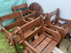 A brown table and 4 chair set