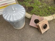 A metal bin and 2 ceramic drain covers