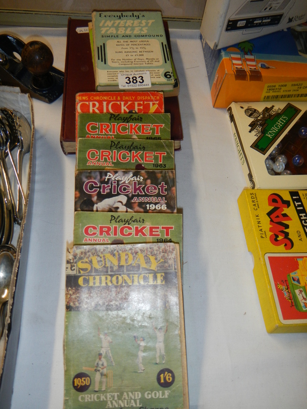 A quantity of Cricket annuals.