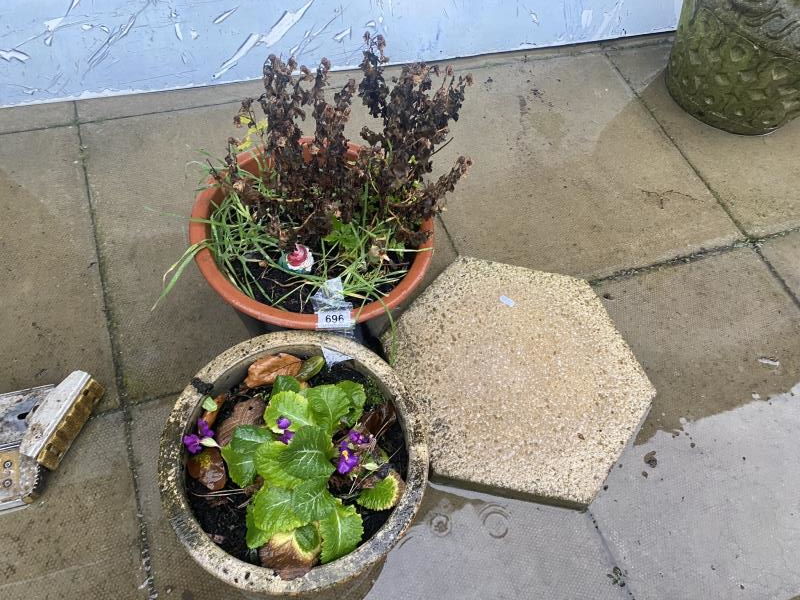 Two stone planters and a hexagonal paving stone