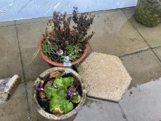 Two stone planters and a hexagonal paving stone