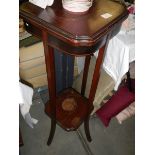 A mahogany inlaid plant stand. COLLECT ONLY.