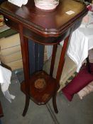 A mahogany inlaid plant stand. COLLECT ONLY.