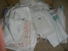 A mixed lot of white and embroidered linen.