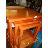 A nest of three teak tables. COLLECT ONLY.