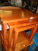 A nest of three teak tables. COLLECT ONLY.