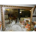 A gilt framed bevel edged mirror,. COLLECT ONLY.