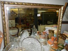 A gilt framed bevel edged mirror,. COLLECT ONLY.