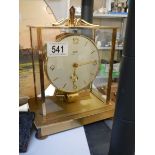 A brass mantel clock.