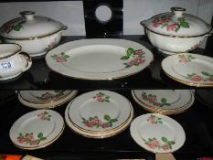 Two shelves of dinner ware by J Fryer.