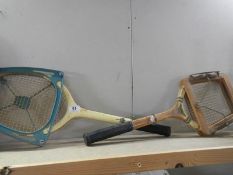 Two old tennis raquets.