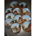 Eleven rural scene collector's plates.