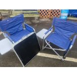 2 folding chairs with side tables and a folding table