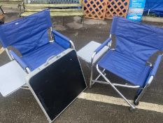 2 folding chairs with side tables and a folding table