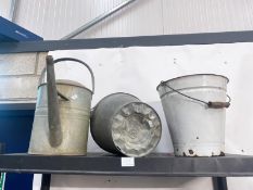 A milking bucket and watering can