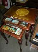 A nest of walnut tables,. COLLECT ONLY.