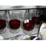 A mixed lot of clear and red glass ware.