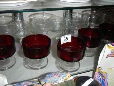 A mixed lot of clear and red glass ware.