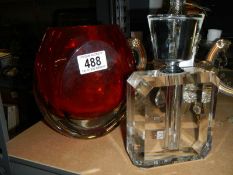 A glass perfume bottle and another item of glass.